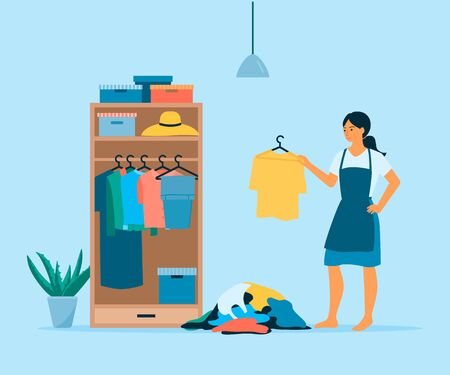 Home organization concept. Flat vector illustration of woman cleaning her wardrobe.のイラスト素材