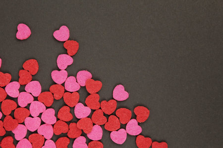 Hearts abstract background in red pink colors, on black texture - Happy Valentine's Day - Hearts...