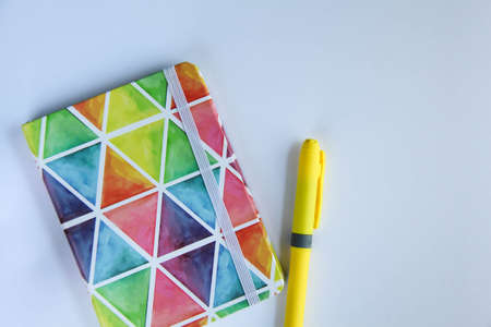 Back to school concept, school supplies, top view of colorful pastel notebooks and pencils on white background bannerの写真素材