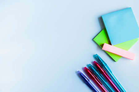 Paper notes and colorful pens. Stickers for taking notes on a white background.の写真素材