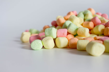 Colorful marshmallows white background with copy space. Top viewの写真素材