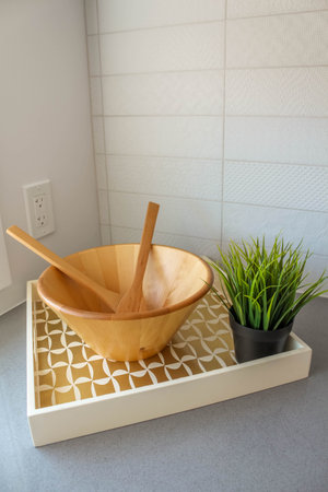 Empty wooden salad bowl on the kitchen table. Interio decorationの写真素材