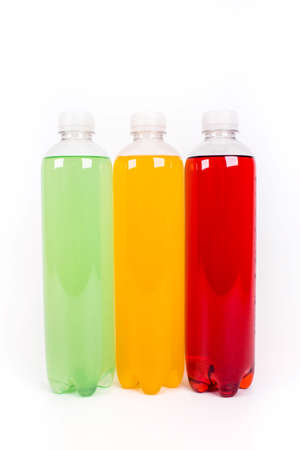 Energy drinks bottles with different flavors on a white background. Juice bottlesの写真素材