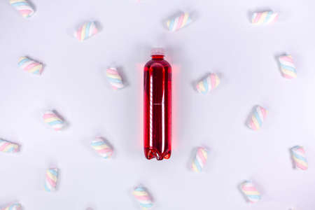 Bottle of red smoothie on white background. Top view. Detox summer drink. Healthy fresh juice bottle. Vegan and vegetarian concept.の写真素材