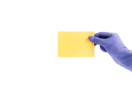 Women's hands hold swatches of the trendy color - illuminating yellow. Selection of year 2021 colors for design of clothes, interiors, websites and publications. Flat lay.の写真素材