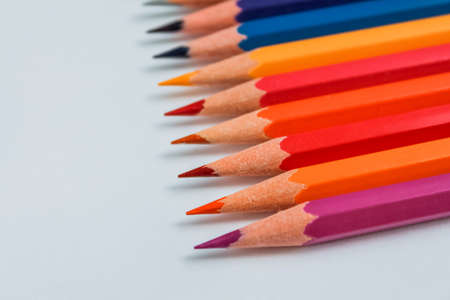 Row of multicolored wooden pencil collection isolated on white backgroundの写真素材