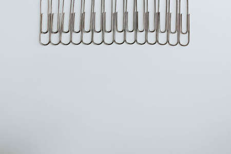 Metal paper clips on whiteの写真素材