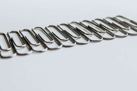 Metal paper clips on whiteの写真素材