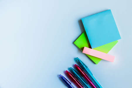 Paper notes and colorful pens. Stickers for taking notes on a white background.の写真素材