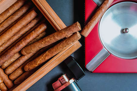 Close view of a cigar on an ashtray with a cutter. Flat layの写真素材