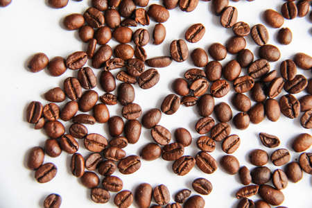Roasted coffee beans with white background. Close view of coffee beansの写真素材
