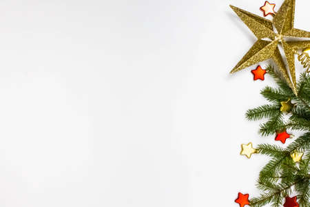 Christmas still life. Red toys, spruce branches and decorative Christmas ornaments on a white background.の写真素材
