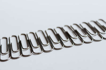 Metal paper clips on whiteの写真素材