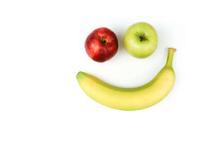 banana and apples smiley on white fashion background with space for text.の写真素材