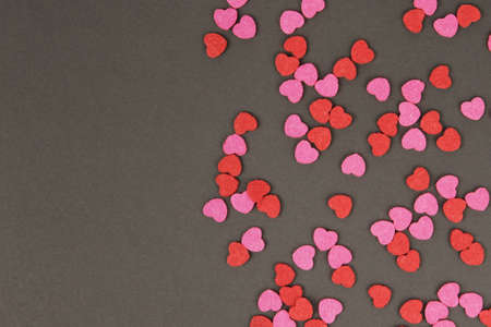 Hearts abstract background in red pink colors, on black texture - Happy Valentine's Day - Hearts Love pattern.の写真素材