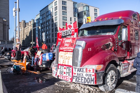 Freedom convoy 2022 in downtown Ottawa, Convoy of freedom. Canadian convoy protest against COVID-19 vaccine. No vaccine mandates Ottawa Ontario, Canada - February 13, 2022のeditorial素材
