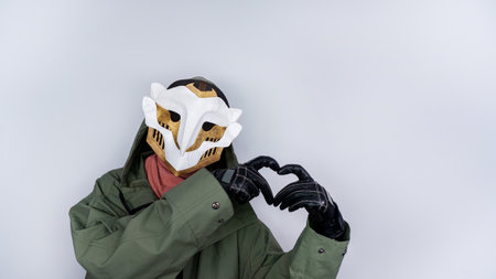 Ekko Firelight masked man from Arcane Netflix TV series. Masked man is holding heart hands. League of Legends. Popular tv show. Ekko's owl mask boy. June 18, 2022 - Gatineau, QC Canadaのeditorial素材