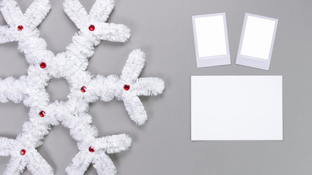 retro photo frames isolated on grey background. Real photo template. Three frames. Mockup. Christmas white fluffy snowflake. Winter decoration..の写真素材