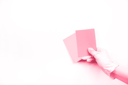 Color of year 2023 Viva Magenta. Hand with color swatches is toned in color of viva magenta. Colour for design of clothes, interiors, websites and publications. New Fashion colour sampleの写真素材