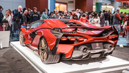 Crowds looking at new car models at Auto show. Lambordghini car on display. National Canadian Auto Show with many car brands. Toronto ON Canada Feb 19, 2023のeditorial素材