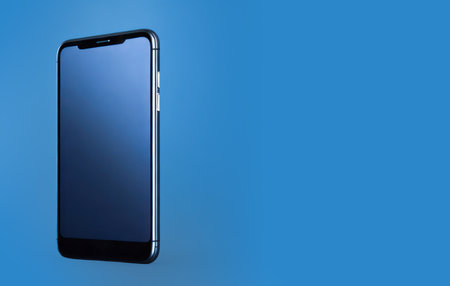 Realistic smartphone blank screen mockup on blue background. Mobile phone template. Space for text. Generative Ai.の素材