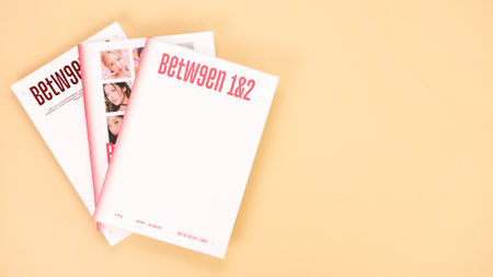 Twice Between 1 and 2 mini Album Box set on yellow. Music CD. South Korean girl group Twice. Space for text. Gatineau, QC Canada - December 27 2022のeditorial素材
