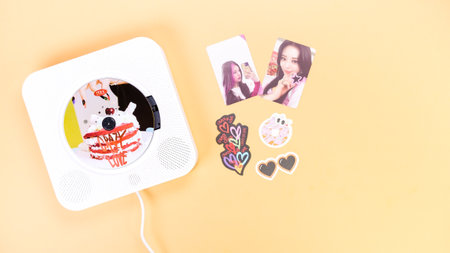 K-pop group Itzy CRAZY IN LOVE 1st Album on yellow background. Special edition music CD. South Korean girl group Itzy. Space for text. Gatineau, QC Canada - March 10 2023.のeditorial素材
