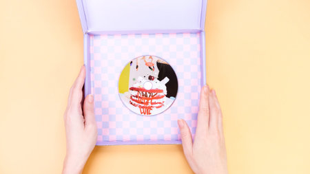 K-pop group Itzy CRAZY IN LOVE 1st Album on yellow background. Special edition music CD. South...