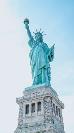 The Statue of Liberty, New York City on sunny blue sky. American symbol. Memorial day, Patriot Day. Space for text. New York NY USA 2023-07-30.のeditorial素材