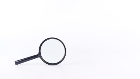 Black magnifying glass with handle on white background. Society questions, looking for answers.の写真素材