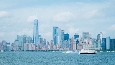 A daytime establishing shot of the lower Manhattan skyline from across the Hudson River in New...