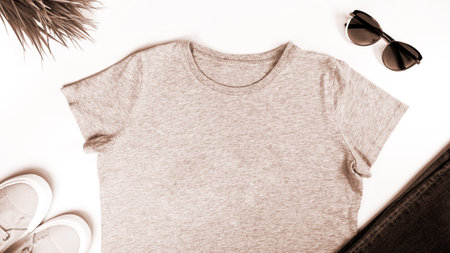 Light brown unisex t shirt mock up flat lay on white background. Mockup t-shirt and summertime. Template blank shirtの写真素材