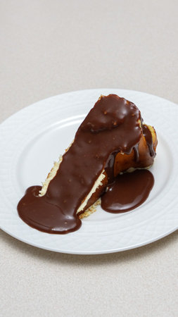 Close-up of a slice of New York-style cheesecake on a white plateの写真素材