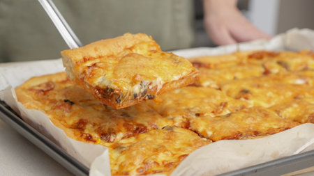 Homemade square pizza with cheese and sausage topping served on wooden table Square pizza, full cheese spread organic pizza healthy pizza.の写真素材