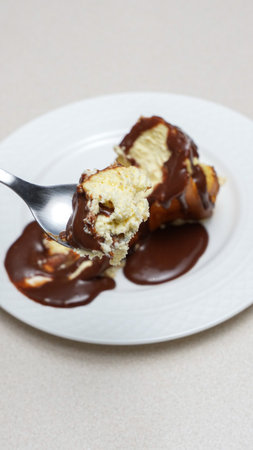 Close-up of a slice of New York-style cheesecake on a white plateの写真素材