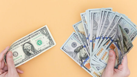 The image depicts a single dollar bill contrasted with a large stack of hundred-dollar notes,...