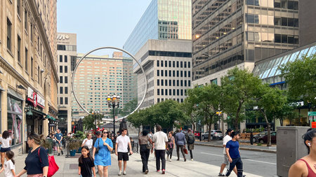 Montreal QC, Canada - August 03, 2025: The Ring art installation in Montreal, framed by busy streets...