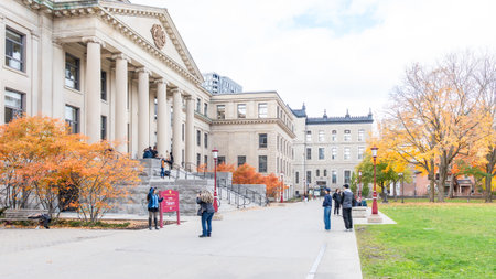 Ottawa ON, Canada - October 25, 2025: View of uOttawa University featuring historic buildings, colorful autumn trees, and students enjoying the campus, creating an inviting educational environmentのeditorial素材