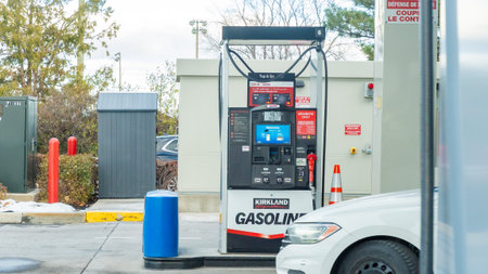 Ottawa ON, Canada - November 22, 2025: Gasoline pump labeled Kirkland is visible at a gas station...