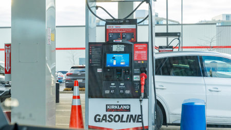 Ottawa ON, Canada - November 22, 2025: Kirkland gasoline pump is visible at a fuel station with...