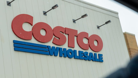Ottawa ON, Canada - December 05, 2025: Exterior view of a Costco Wholesale store showcasing prominent red and blue signage with lighting fixtures aboveのeditorial素材