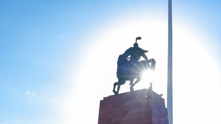 Bishkek, Kyrgyzstan - October 01, 2024: Statue of Manas at Ala Too Square, beautifully silhouetted against the sky, representing Kyrgyz heritage and prideのeditorial素材