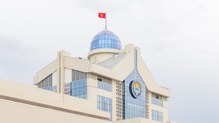 Bishkek, Kyrgyzstan - October 06, 2024: New White House, Yntymak Ordo in Kyrgyzstan, features modern design elements, a prominent dome, and the national flag waving proudlyのeditorial素材