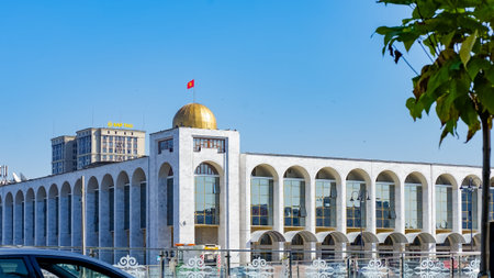 Bishkek, Kyrgyzstan - October 01, 2024: Soviet-era architecture on Ala-Too Square features a golden dome, blending history with contemporary urban elementsのeditorial素材