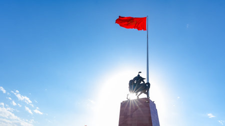 Bishkek, Kyrgyzstan - October 01, 2024: Kyrgyzstan flag is prominently displayed at Ala-Too Square,...