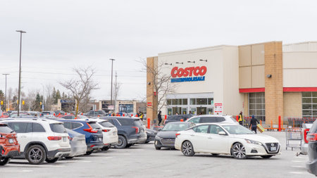 Ottawa ON, Canada - December 05, 2025: Exterior of a Costco wholesale store with parked vehicles and...