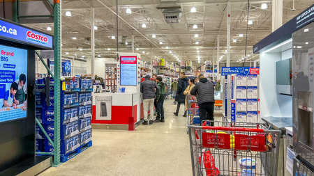 Ottawa ON, Canada - January 18, 2026: Interior view of a Costco shopping store featuring customers...