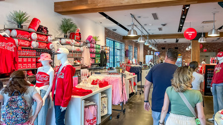 Orlando FL, USA - March 06, 2026: Interior view of a Coca-Cola merchandise shop showcasing red...