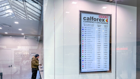 Ottawa ON, Canada - February 08, 2026: Calforex currency exchange display board lists multiple...