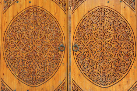 Khiva: carved wooden doors with traditional ornamentの写真素材